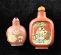 Two Chinese Yixing pottery snuff bottles, 1800-1900, the first slip decorated to each side with with