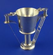 A George V Arts & Crafts silver two-handled pedestal cup. of tapering cylindrical form, the barrel