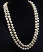 A double strand cultured pearl necklace with white gold, sapphire and diamond set clasp, 19.5in.