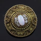 A Victorian gold, white opal and diamond set circular locket brooch, with cannetile work decoration,