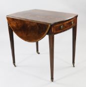 A George III mahogany and satinwood crossbanded oval Pembroke table, with single end drawer opposing