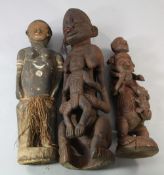 A Papua New Guinea Sepik River large carved wooden figure, modelled as a mother carrying her