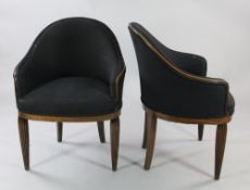 A pair of Art Deco beech tub shape armchairs, with fluted tapering supports