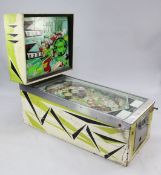 A 1960's Williams Electronics Inc. Beat Time The Bootles pinball machine, with glass backplate and