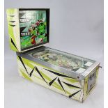 A 1960's Williams Electronics Inc. Beat Time The Bootles pinball machine, with glass backplate and