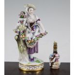Two Meissen figural scent bottles, late 19th century, the larger example modelled as lady with an