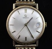 A gentleman's 1960's 9ct gold Omega manual wind wrist watch, with baton numerals and date