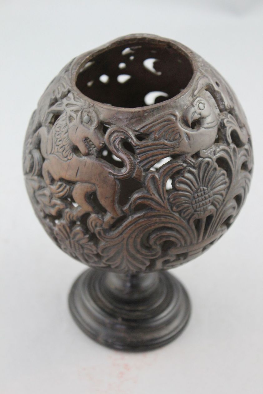 A 19th century carved and pierced coconut cup or goblet, decorated with owls, birds and vases of - Image 5 of 5