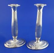 A pair of 20th century Norwegian 830 standard silver candlesticks, with fluted stems and bases, 8.