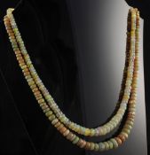 A double strand graduated facetted opal bead necklace, with 9ct gold circular clasp, 15in.