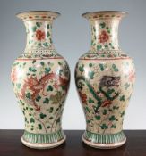 A pair of large Chinese famille verte crackle glaze vases, late 19th century, each painted with four
