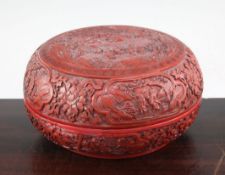 A Chinese cinnabar lacquer box and cover, 19th century, of compressed globular form, carved in