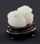 A Chinese white jade carving of two mandarin ducks, 18th / 19th century, one biting a sprig of