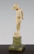 Attributed to Ferdinand Preiss, An Art Deco carved ivory figure of a young girl, on a circular