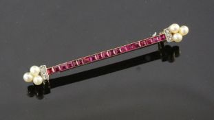 A 1920's/1930's French 18ct gold, ruby , diamond and seed pearl bar brooch by Lacloche Freres,