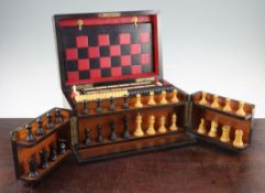 A Victorian burr walnut cased games compendium, with ebony and boxwood chess pieces, with lift out