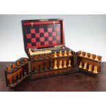 A Victorian burr walnut cased games compendium, with ebony and boxwood chess pieces, with lift out