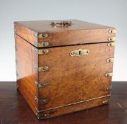 A 19th century mahogany decanter box, with brass strap corners, later converted to house a writing