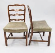 A set of four George III style mahogany ladderback dining chairs, with brass studded overstuffed