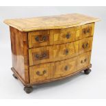 An 18th century German marquetry inlaid walnut serpentine commode, with three long drawers, on