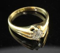 A mid 20th century 18ct gold and claw set solitaire diamond ring, the round old cut stone weighing