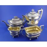 A George III demi-fluted silver four piece tea and coffee set by J.W. Story & William Elliot, of