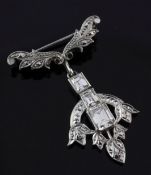 A mid 20th century platinum and diamond drop pendant brooch, of tulip head form and set with three