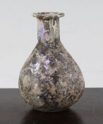 A Syrian gourd flask, c. 6th century B.C., with everted rim and mineral iridescence, 9cm