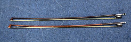 A 19th century violin bow marked Vuillaume, Paris, together with another similar bow marked Dodd