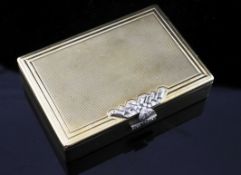 A 1940's Art Deco Cartier 9ct gold and diamond rectangular box, with finely ribbed decoration and