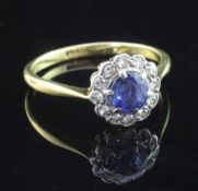 A 1940's/1950's 18ct gold, sapphire and diamond cluster ring, size O.