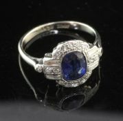 A 1930's Art Deco 18ct white gold and platinum, sapphire and diamond cluster ring, set with