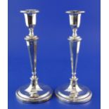 A pair of Edwardian silver candlesticks, with tapering octagonal stems, Thomas Levesley,