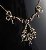 An Edwardian 9ct gold, amethyst and seed pearl drop necklace, with flower head motifs and ribbon bow