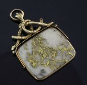 A gold mounted gold veined white quartz spinning fob, the large rectangular quartz with rustic