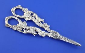 A pair of late Victorian silver grape shears, each handle decorated with a fox amongst fruiting