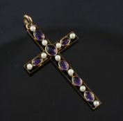An Edwardian 9ct gold amethyst and seed pearl set cross pendant, with inscription en verso, in