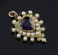 An Edwardian style gold, amethyst and split pearl heart shaped pendant, set with heart shaped