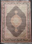 A central Persian carpet, with central shaped oval medallion within a tightly packed field of