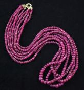 A quadruple strand facetted ruby bead necklace, with circular clasp, 22in.