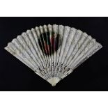 A 19th century French pierced bone fan, with pierced silver and mother of pearl guard sticks,