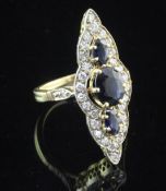 A French 18ct gold, sapphire and diamond up-finger ring, of shaped marquise form, with diamond set