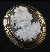 A Victorian gold mounted cameo brooch, of oval form, carved with a bacchante to sinister, with Greek