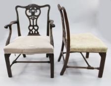 A set of eight mahogany Chippendale style dining chairs, two with arms, six singles, the carved