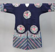 A Chinese dark blue satin and embroidered lady's robe, Qing dynasty, worked with butterfly and