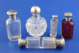 Five assorted Victorian and later mounted glass scent bottles, four with silver mounts including