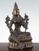 A Sino-Tibetan bronze seated figure of Green Tara, on a double lotus throne, 30cm