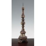 An 18th century Italian carved wood and gesso pricket candlestick, with knopped stem, decorated