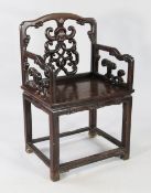 A late 19th century Chinese rosewood armchair, the back with central carved pierced splat with bat