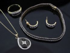 A 9ct gold and two colour diamond suite of jewellery, comprising a bracelet, pair of half hoop